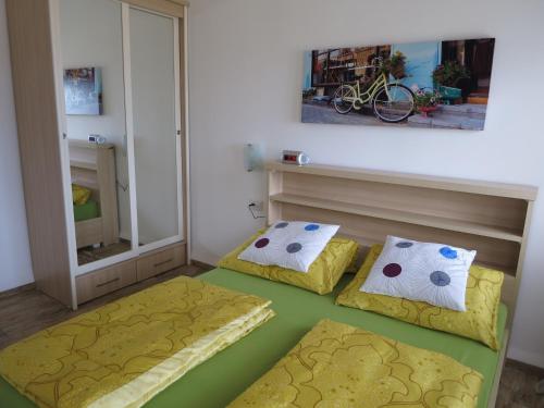 a room with two beds and a mirror at Apartment Haifa in Haifa