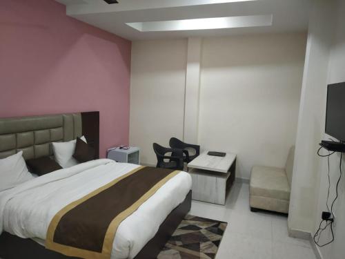 מיטה או מיטות בחדר ב-Hotel Hirapanna