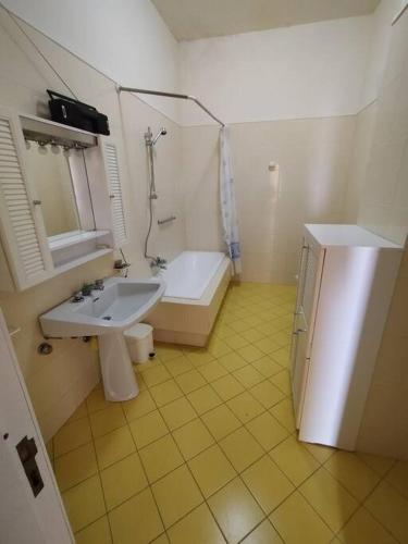 a bathroom with a tub and a sink and a bath tub at CasaVela2 in Ariano Irpino