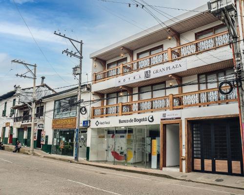 a building on the side of a street at Hotel Gran Plaza San Agustin in San Agustín