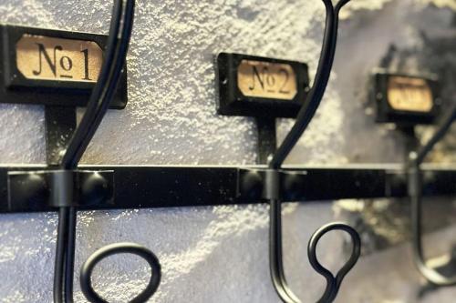 a close up of two lights with snow on them at Romantic home stone with amazing view lake of Como and Oleandra in Laglio