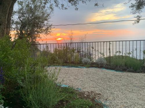 a fence with the sunset in the background at Antonio Massa Lubrense in Massa Lubrense