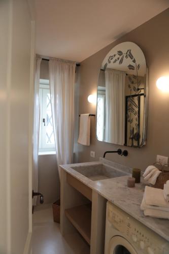a bathroom with a large sink and a mirror at Agriturismo I Casali in Fiumaretta di Ameglia