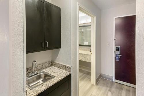 a kitchen with a sink and a walk in closet at Comfort Inn & Suites in Andrews
