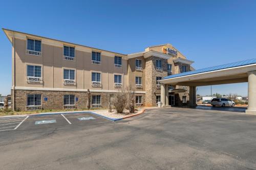 a hotel parking lot in front of a building at Comfort Inn & Suites in Andrews