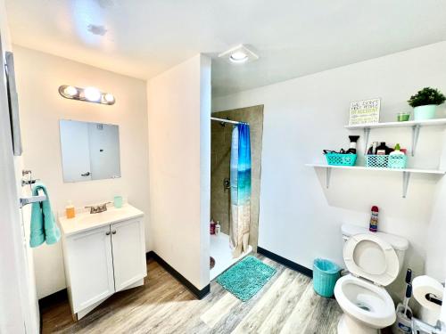 a bathroom with a toilet and a sink and a shower at Studio Apartment with Shared Bathroom 10 minutes walk to University of WA in Seattle