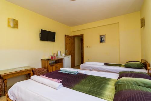 Ένα ή περισσότερα κρεβάτια σε δωμάτιο στο Fener Guest House