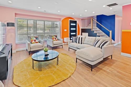 a living room with a couch and a table at Stylishly Renovated 5-Bedroom Home in AC - Perfect for Groups and Families in Atlantic City