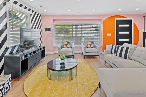a living room with a couch and a table at Stylishly Renovated 5-Bedroom Home in AC - Perfect for Groups and Families in Atlantic City