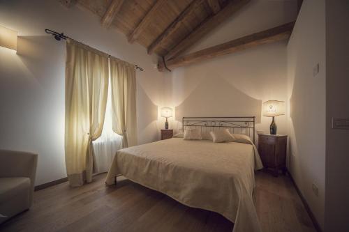 Säng eller sängar i ett rum på Country House Giusti Abazia