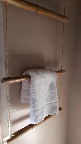 a towel rack in a bathroom with two towels at Wild Wasi Lodge - Adventures - Guided Tours in Puyo