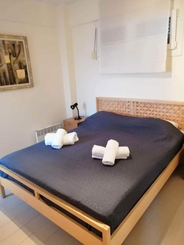 two pillows on a bed in a bedroom at Breathtaking sea view in Kavála