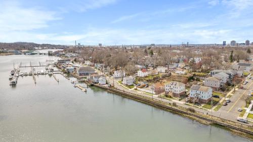 an aerial view of a town next to a river at Gorgeous Waterfront 2:1 - 2 houses in 1 building. in New Haven