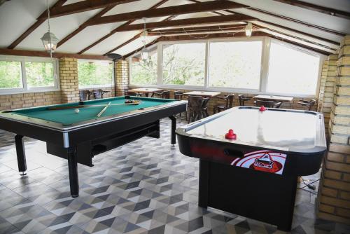 a billiard room with two pool tables in it at Vila Kraljev Breg Fruška Gora Pool and Padel in Čortanovci