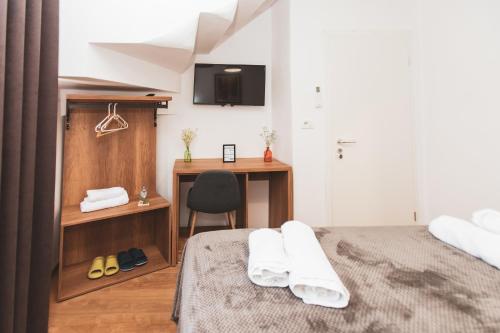 Postel nebo postele na pokoji v ubytování Hotel Tier Center