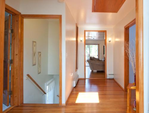 a hallway with a door leading to a living room at Beautiful Apartment-5 Beds-Full Kitchen-Parking-Super Clean! in Boston