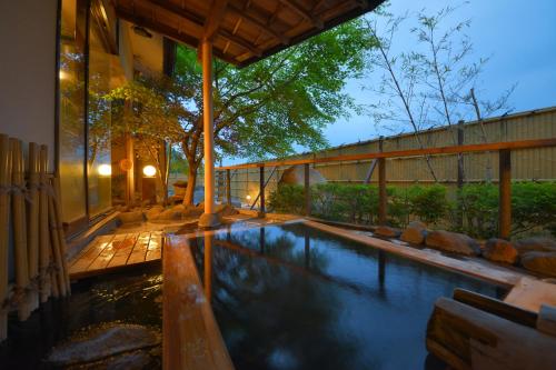 a swimming pool in the backyard of a house at Hotel Casual Euro in Nikko