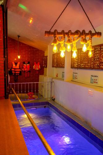 a swimming pool with blue water in a room at Belljem Homes -your own private resort -2 BHK GF in Trichūr