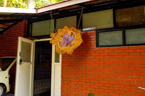 a sign on the side of a brick building at Belljem Homes -your own private resort -2 BHK GF in Trichūr