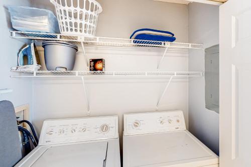 a laundry room with a washer and dryer at Sweet Spot at Woodland Shores in Destin