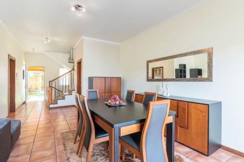 a dining room with a table and chairs at Eddy´s House in Santa Cruz