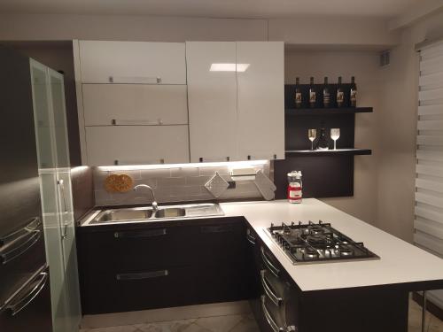 a kitchen with a sink and a stove top oven at Chrisiola in Galleno