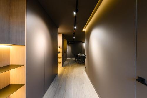 a hallway leading to a dining room with a table at Luxury Apartments-Belochka in Uzhhorod