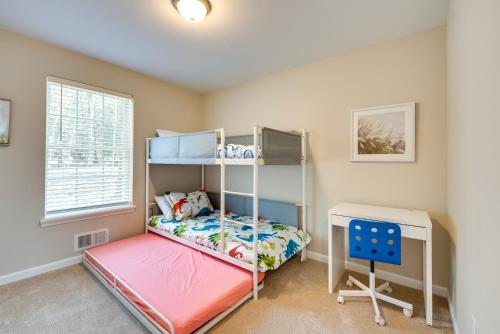 a bedroom with a bunk bed and a desk at Pocono Lake Vacation Rental Community Amenities! in Pocono Lake