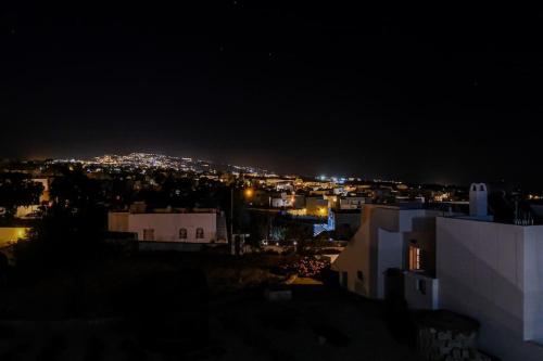 a view of a city at night with lights at Ageri Suite in Vóthon