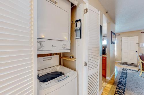 a white washer and dryer in a room with a door at Vista Del Lago in Stateline