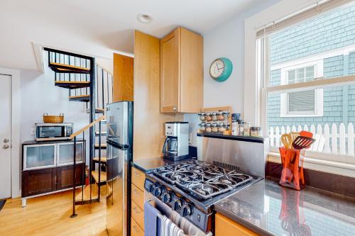 a kitchen with a stainless steel stove top oven at The Bradford Bistro in Provincetown