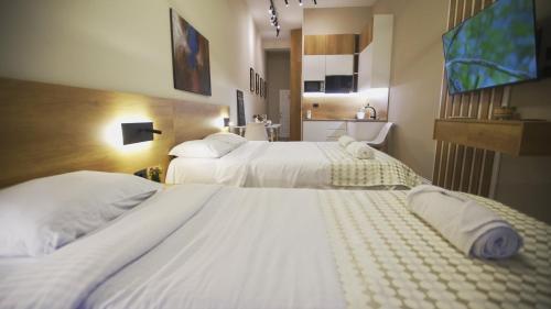 Ένα ή περισσότερα κρεβάτια σε δωμάτιο στο Daily Rent Studio Apartments