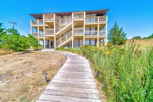 a wooden path leading to a building on the beach at Mermaid Cove in North Truro