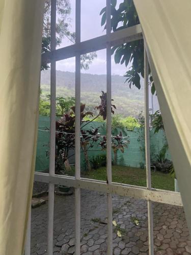 a view from a window of a garden at Espaço Verde in Vitória