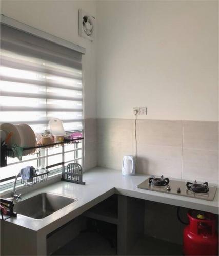 a kitchen with a sink and a counter top at Salak Pekerti Homestay KLIA KLIA2 in Sepang