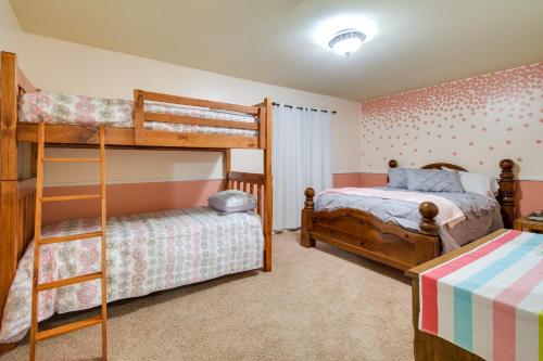 a bedroom with two bunk beds and a twin bed at Rural New York Vacation Rental with Deck in Romulus