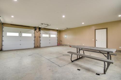 an empty garage with a bench in the middle at Rural New York Vacation Rental with Deck in Romulus