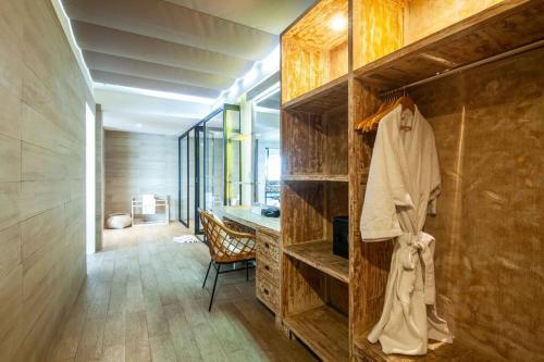a room with a closet with a desk in it at Nusa dua Ocean View with Private Beach in Nusa Dua