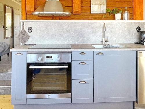 a kitchen with a sink and an oven at 4 person holiday home in MARIESTAD-By Traum in Mariestad