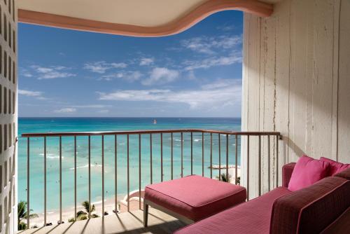 a balcony with a view of the ocean at The Royal Hawaiian, A Luxury Collection Resort, Waikiki in Honolulu