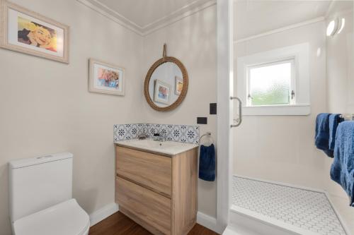 a bathroom with a sink and a mirror at Harbour View in Kohukohu Town District