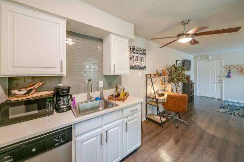 a kitchen with white cabinets and a sink at The Joplin House - Austin - Zilker Park Studio in Austin