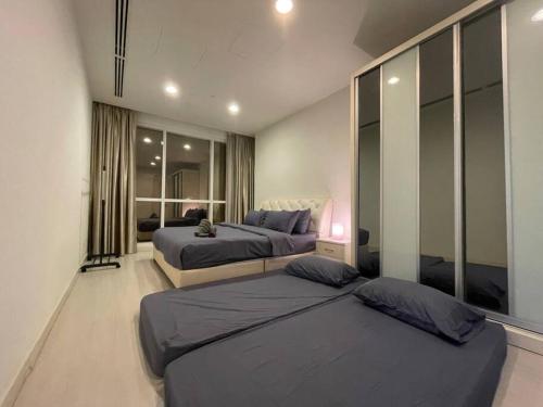 Binjai 8 Premium Soho, KLCC, nearby LRT by EC tesisinde bir odada yatak veya yataklar