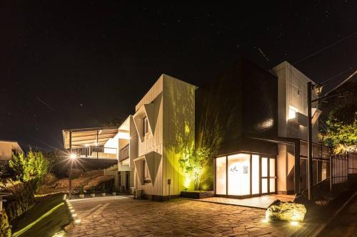 a building at night with lights on it at TenangTenang-Izu Oceanic Villa- in Futo