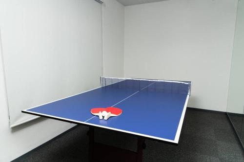 a ping pong table in a room with at TenangTenang-Izu Oceanic Villa- in Futo