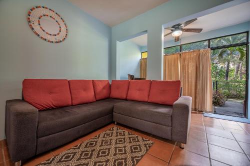 a brown couch in a living room with a window at Dolce Vita 7025 in Coco
