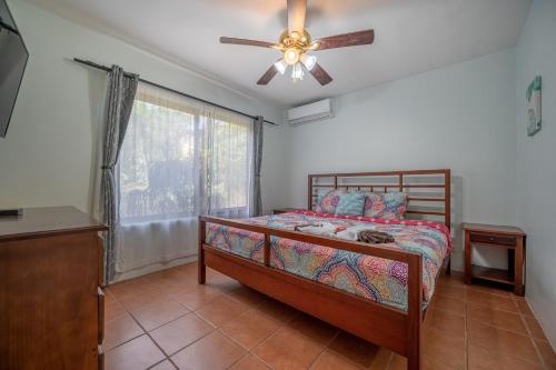 a bedroom with a bed and a ceiling fan at Dolce Vita 7025 in Coco