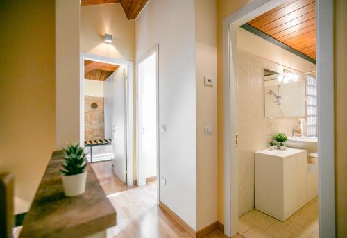 a hallway of a bathroom with a sink and a mirror at NonSoloPanorama in Monte San Vito