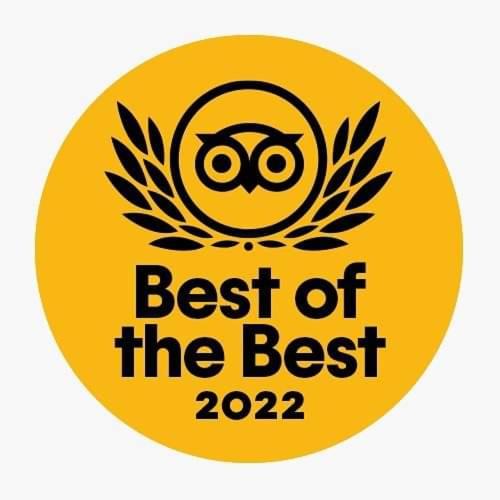 a yellow sign with the words best of the best at Nikos Hotel in Diafani