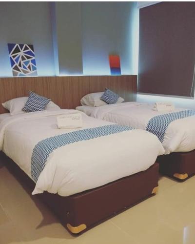 Ένα ή περισσότερα κρεβάτια σε δωμάτιο στο The Holiday Guest House